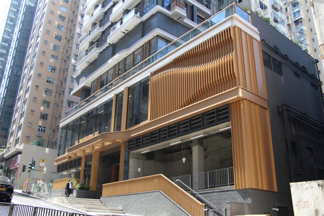 Nos. 5–17 Western Street — gold-finish performance louvre facade